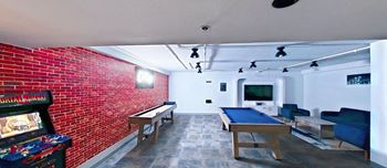 Resident chill lounge, shuffleboard table, pool table and classic arcade games